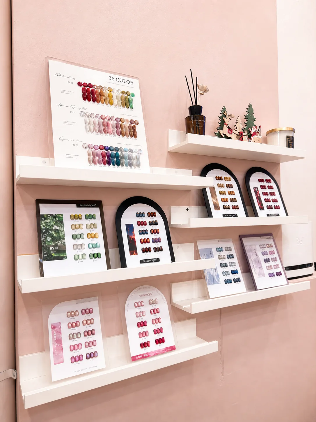 Curated nail colour sample wall inside Ongles Blossom Montréal