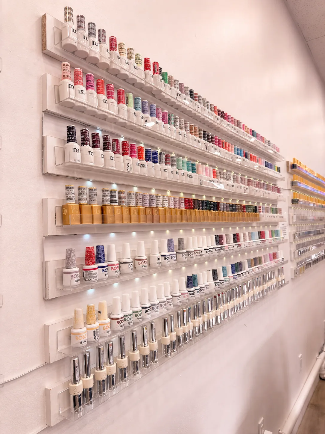 Extensive wall of nail polish colours at Ongles Blossom Montréal
